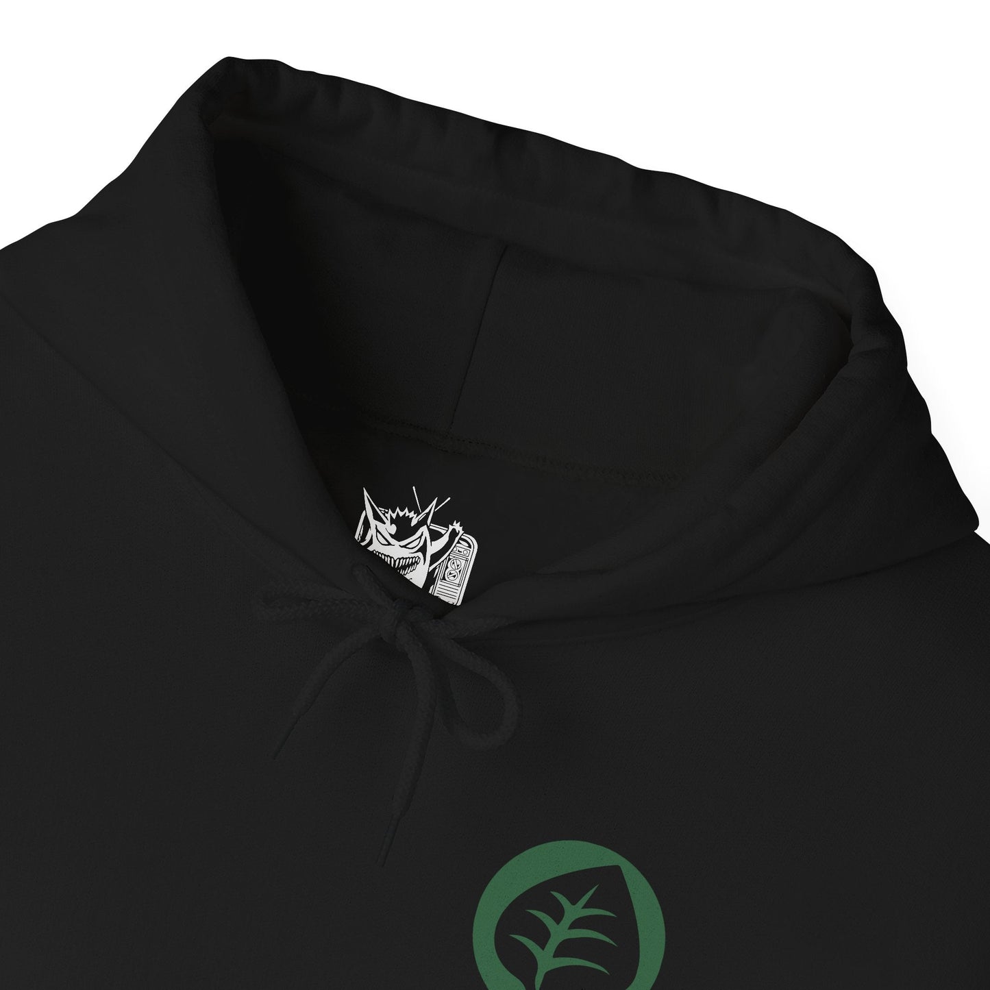 Folded Hooded Sweatshirt illustration of powerful Grass-type Pokémon emerging from an ancient woodland where moss-covered ruins, giant roots, and glowing foliage create a magical atmosphere. Leaves swirl through the air as vibrant green energy radiates across the forest floor. The composition emphasizes the spirit of nature, botanical power, and the timeless connection between Grass-type Pokémon and the living world.