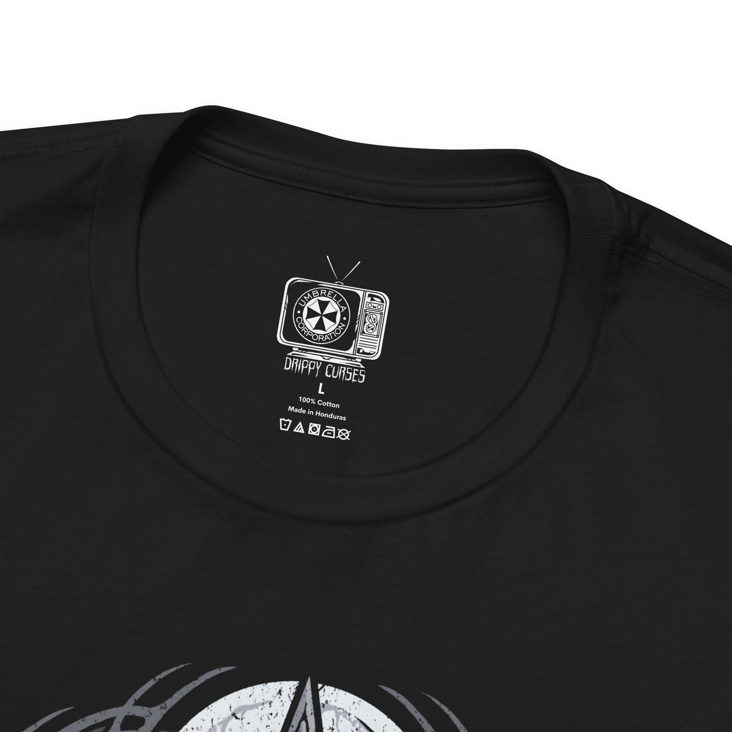 Folded T-shirt design of Leon S. Kennedy from Resident Evil 2, a rookie police officer battling through a zombie outbreak in Raccoon City, standing in a dimly lit street filled with chaos. He aims his handgun at approaching undead as shadows close in around him, capturing a determined survivor defined by courage, precision, and relentless pressure.