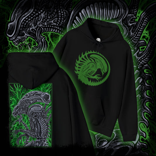 Thumbnail of a Hooded Sweatshirt of a Xenomorph standing over its prey in a dimly lit chamber, its glossy exoskeleton reflecting harsh industrial lighting. Shadows stretch across the floor as its elongated skull tilts forward, ready to attack. The composition emphasizes isolation, terror, and the unstoppable instinct of a creature designed purely for survival and dominance.