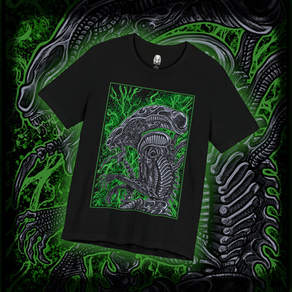 Thumbnail of a T-Shirt design of a Xenomorph from Alien, emerging from deep shadows with its elongated biomechanical head glistening under dim industrial light. Acidic saliva drips from its jaws as its inner mouth prepares to strike. The design captures the creature’s perfect organism form, blending organic horror with cold alien precision in a setting filled with tension and dread.
