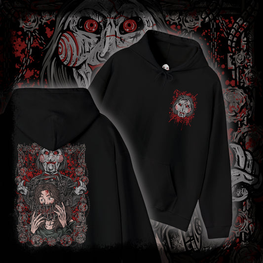 Thumbnail of a Hooded Sweatshirt of Billy the Puppet staring forward with a sinister grin, his black suit and red bow tie framed by chains, gears, and rusted metal. A dim industrial setting fades behind him as ominous red light highlights his face. The composition emphasizes psychological tension, horror, and the iconic image of the puppet who announces Jigsaw’s deadly games.