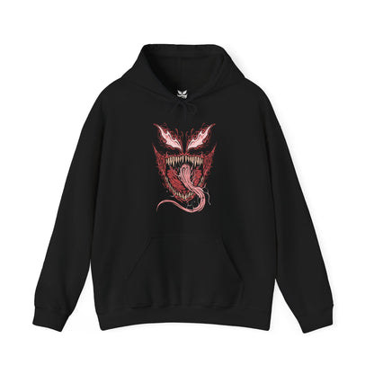 Image 4 of a Hooded Sweatshirt of Carnage standing amid destruction as symbiote blades and tendrils spiral outward from his body like living weapons. The crimson creature towers against a dark urban backdrop while debris and shadow surround him. The composition emphasizes horror, chaos, and the overwhelming bloodthirst that defines the Carnage symbiote’s terrifying existence.