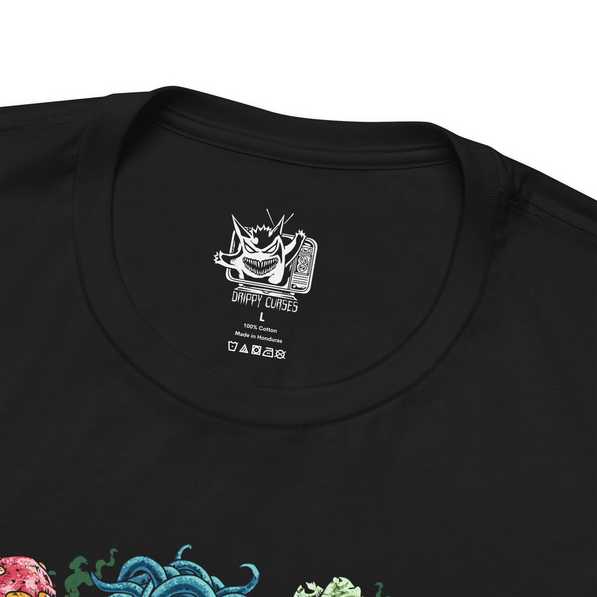 Folded T-Shirt design featuring a collection of Grass-type Pokémon gathered within a vibrant enchanted forest, surrounded by towering trees, flowering vines, and glowing leaves. Sunlight filters through the canopy as nature flourishes around them, highlighting their deep connection to forests, plants, and natural energy. The design captures the peaceful beauty, resilience, and elemental power that define Grass-type Pokémon.