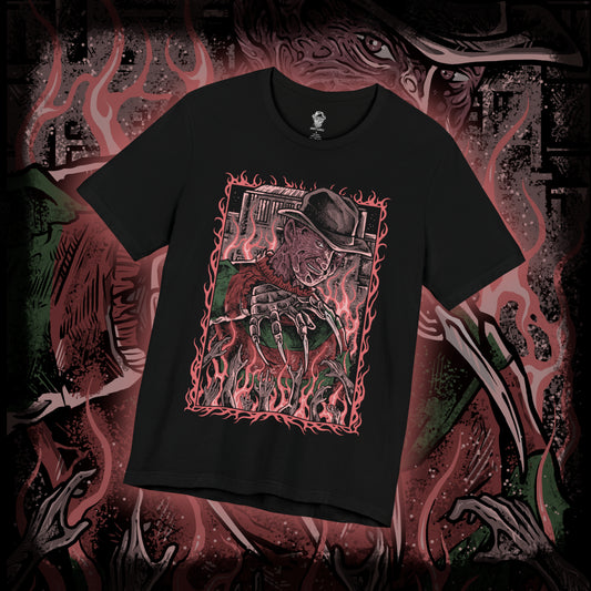 Thumbnail of a T-Shirt design of Freddy Krueger from A Nightmare on Elm Street, emerging from a nightmare-filled darkness with his bladed glove extended toward the viewer. His burned face twists into a sinister grin beneath a worn fedora while red and green stripes fade into shadow behind him. The design captures dreamlike terror, psychological horror, and the unstoppable fear haunting Elm Street.