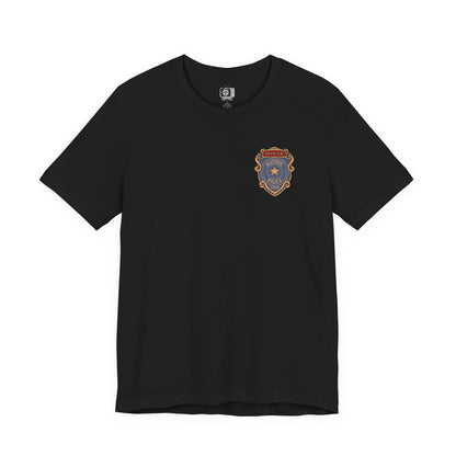 Image 4 of a T-shirt design of Leon S. Kennedy from Resident Evil 2, a young cop fighting off hordes of zombies during the outbreak of Raccoon City, positioned in a tense urban scene. Muzzle flashes light the darkness as the undead advance, capturing a moment of survival driven by instinct, fear, and unwavering resolve.
