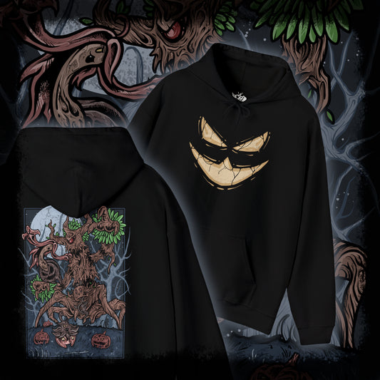 Thumbnail of a Hooded Sweatshirt depicting Trevenant looming over a misty woodland path, its silhouette blending with towering trees as glowing eyes watch from the darkness. Subtle faces seem to form within its bark, hinting at the spirits bound inside. The design reflects Trevenant’s lore as a cursed forest spirit Pokémon, symbolizing vengeance, possession, and the eerie life hidden within Kalos forests.